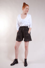 Elastic waist, welt patch pockets, center back gusset. 100% Linen. Black with Olive stripes.