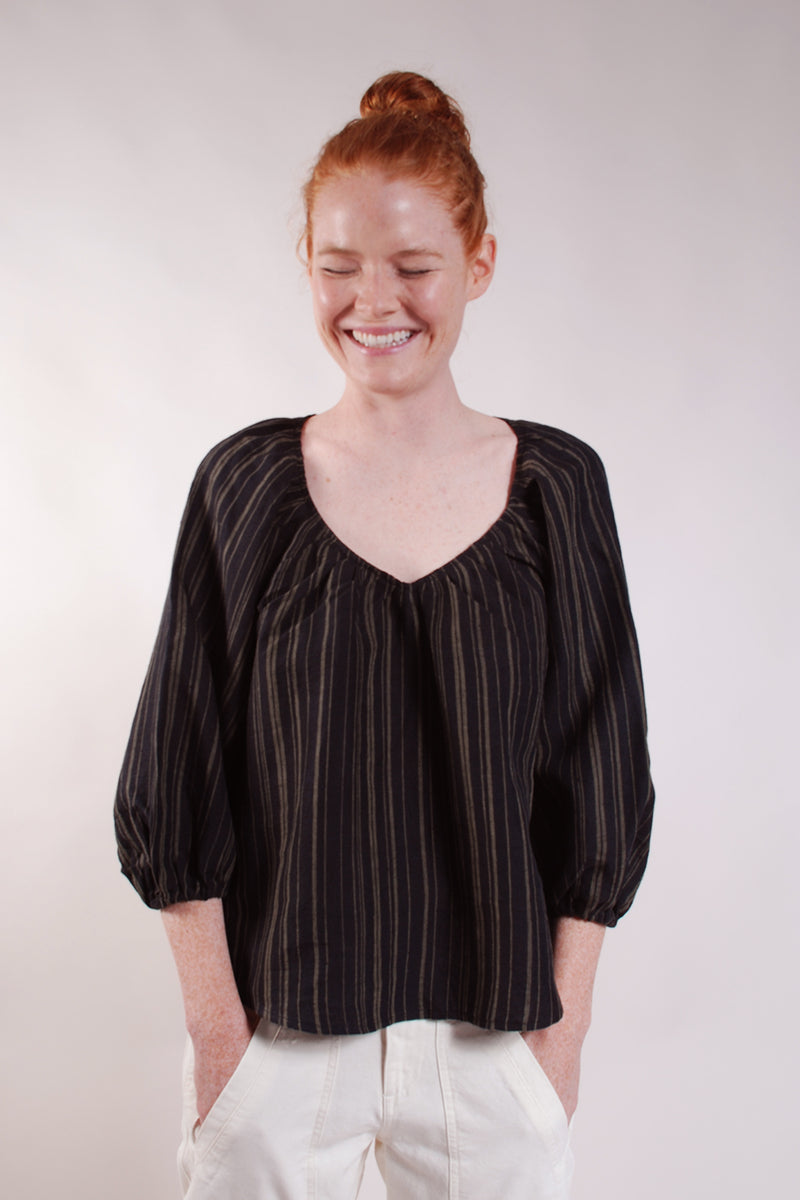 Gathered V neck puff sleeve top. Great everyday thrown on. 100% Linen. Black with Olive stripes.