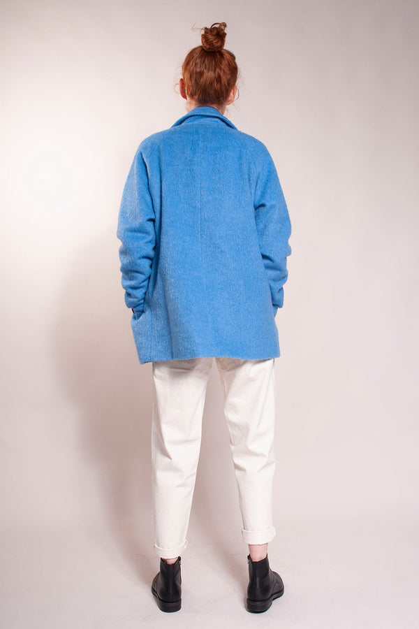 Loose fit, welt chest handwarmer pockets and hidden button hip pockets.  Raglan sleeves.  Hits at hip.  30% Wool/ 70% Polyester. Fully lined.  It's a classic!